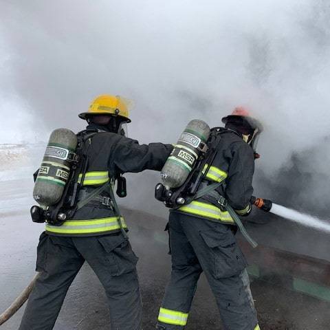 Firefighters putting out burn cube