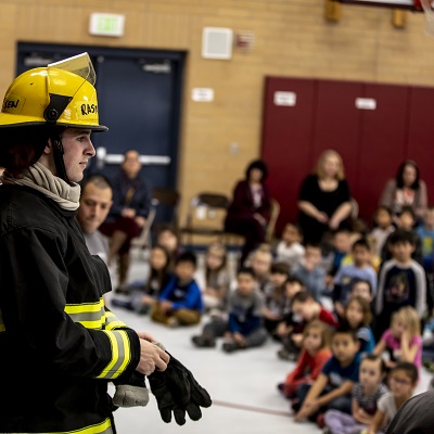 Firefighter teaching students