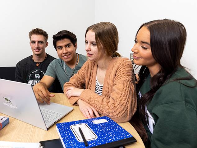 students working together on computer