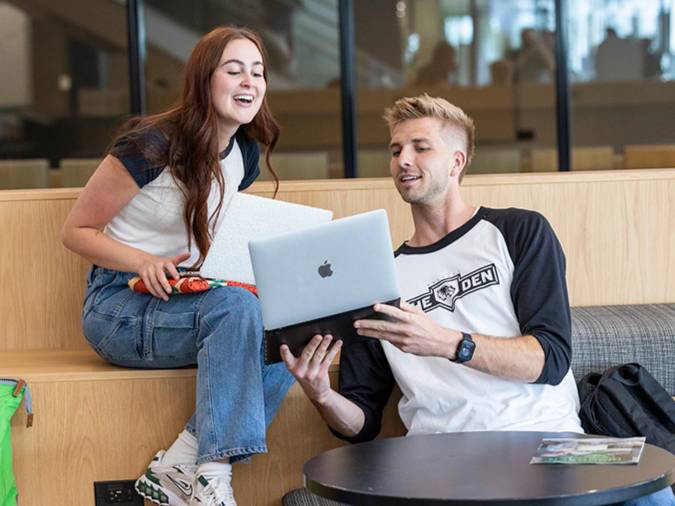 students working together on their computers