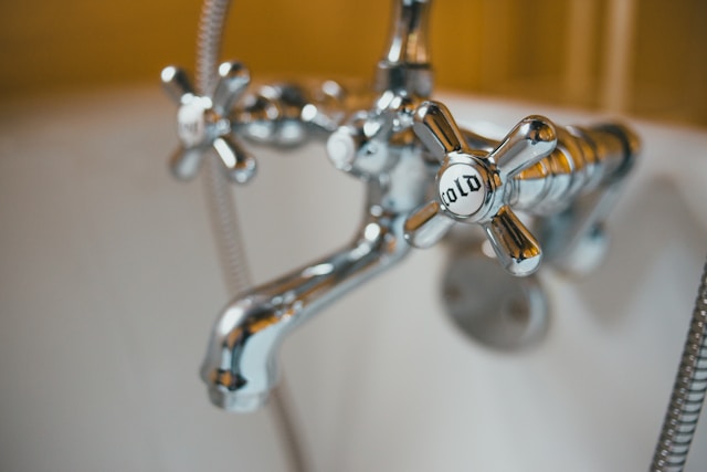 closeup of a bathtub faucet