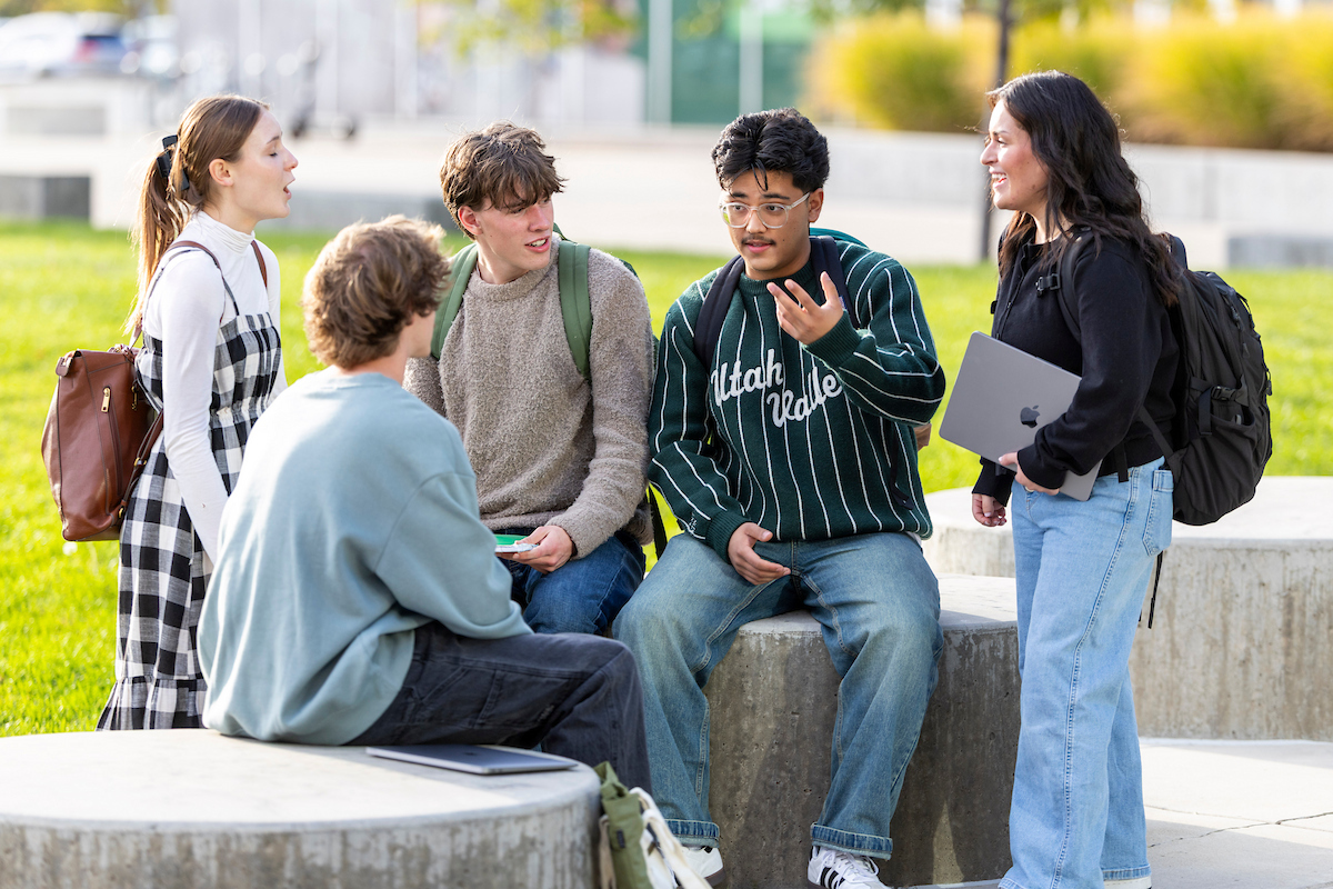 group of students sitting and having a conversation