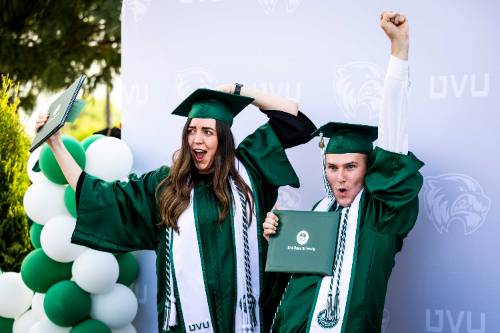 two celebrating graduates