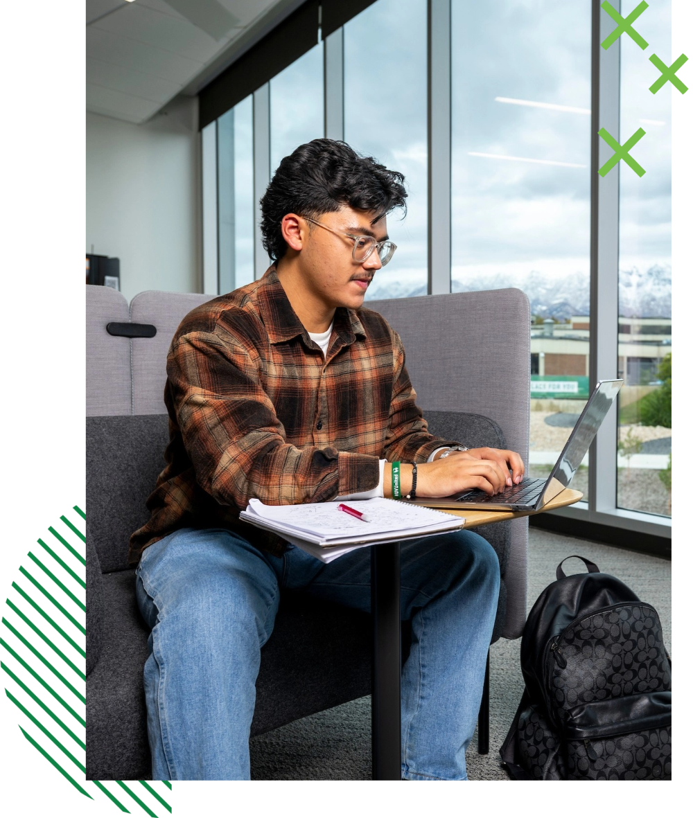student typing on a laptop