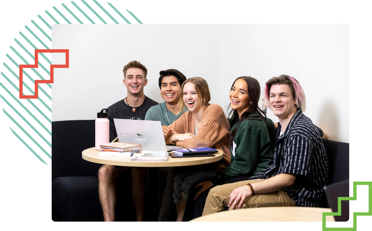 students seated around a table smiling