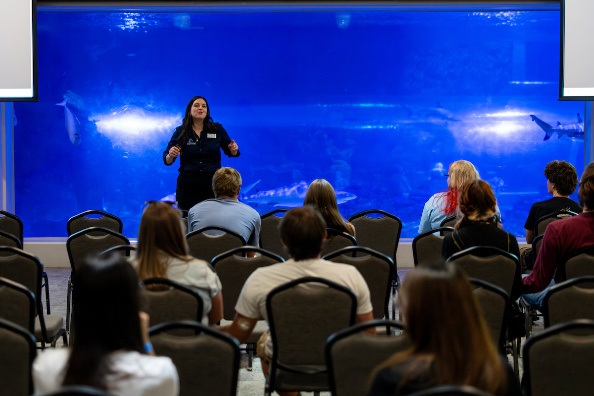 Loveland Aquarium employee speaking in front of audience