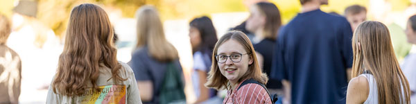 Student walking on UVU campus