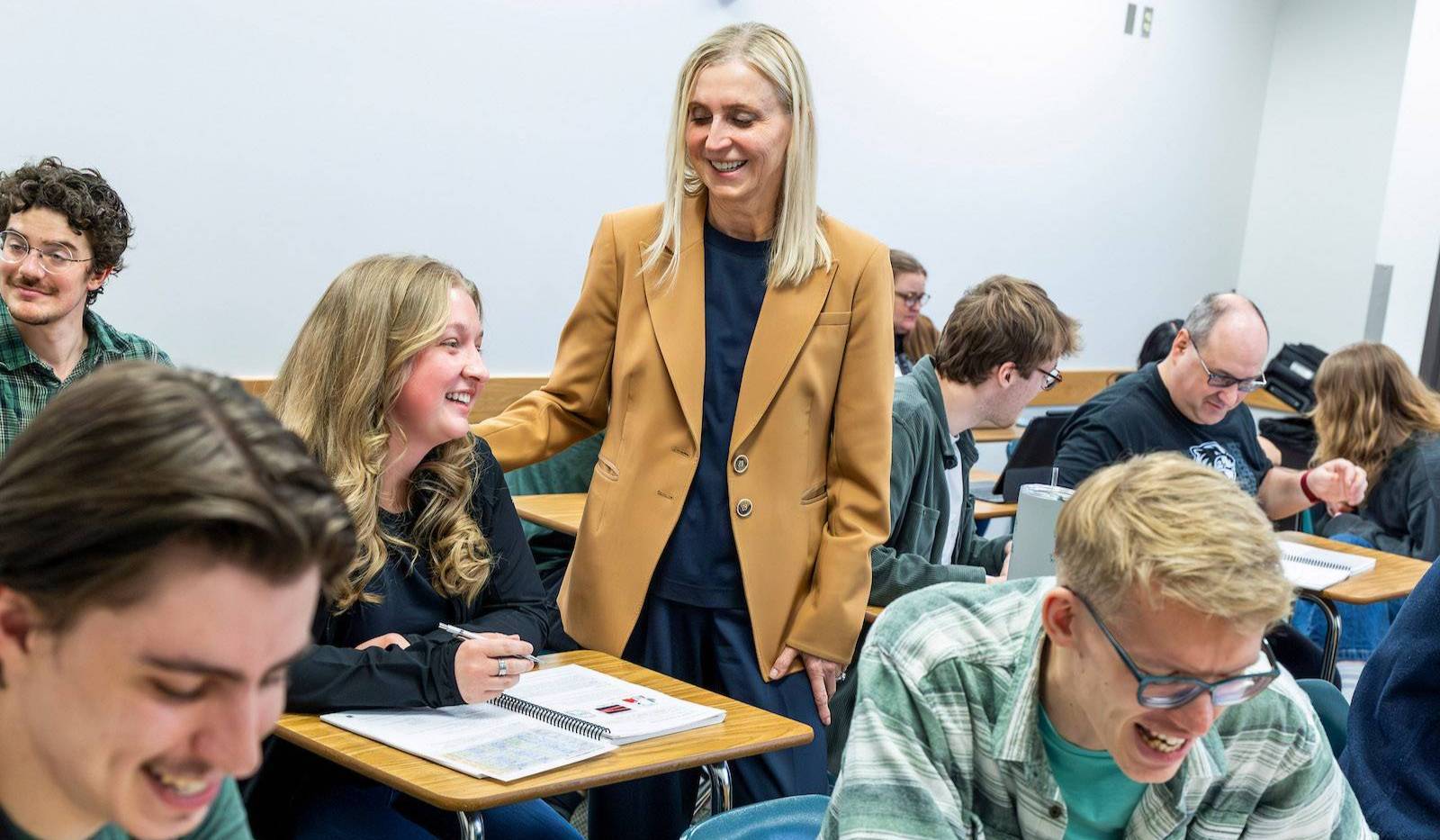 Russian Studies professor Olga Jarrell talking one on one with a student in class