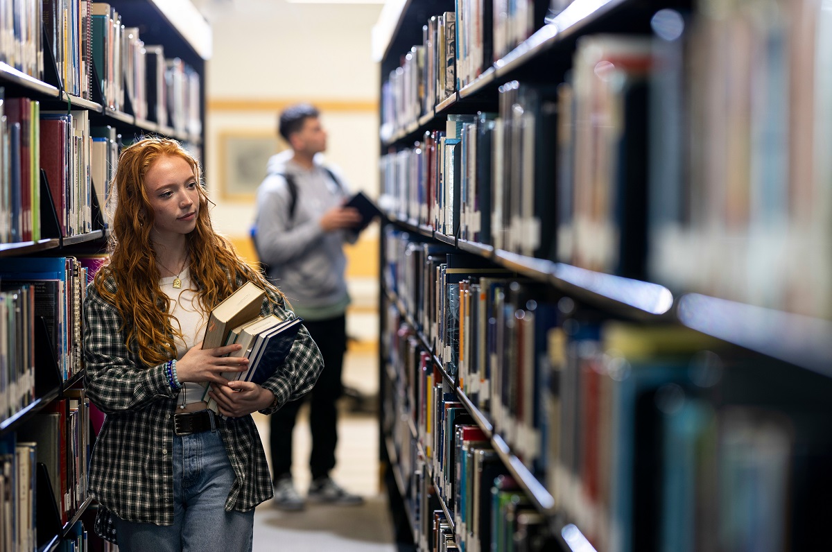 Students in the library stacks at UVU Fulton Library