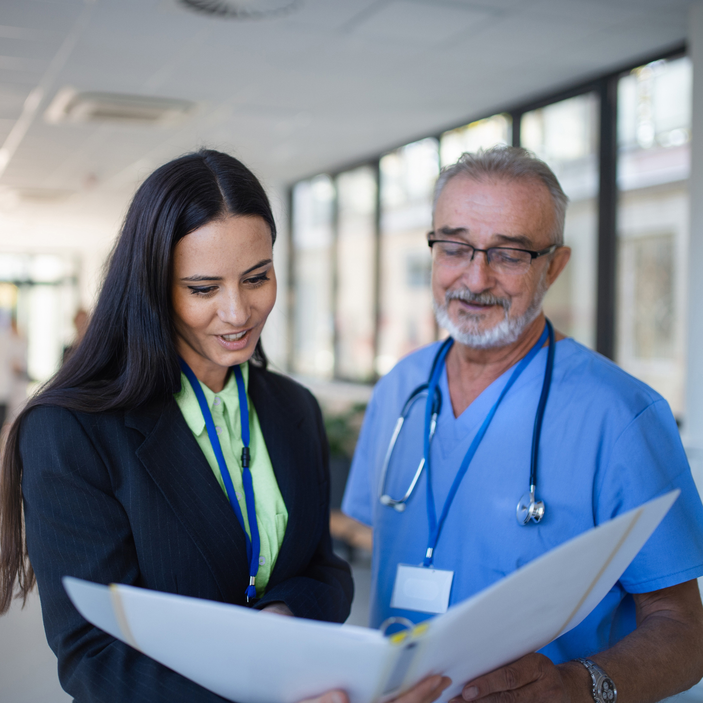 two people looking at a document