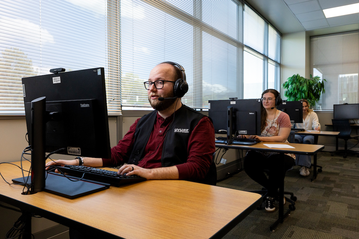 tech support person seated at their desk