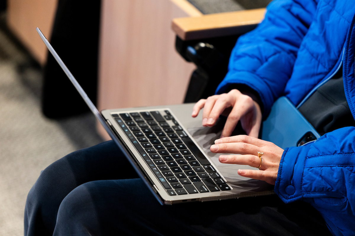 person typing on a laptop
