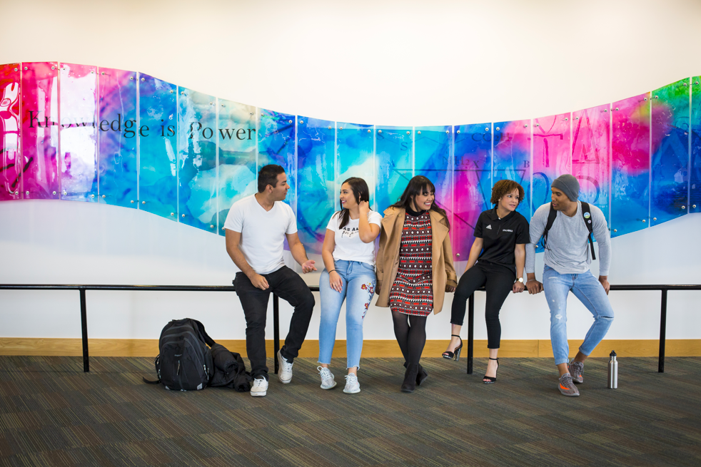 students in front of an art installaiton