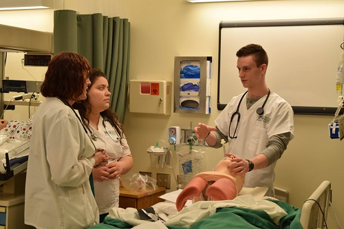 Students and faculty in a lab scenario