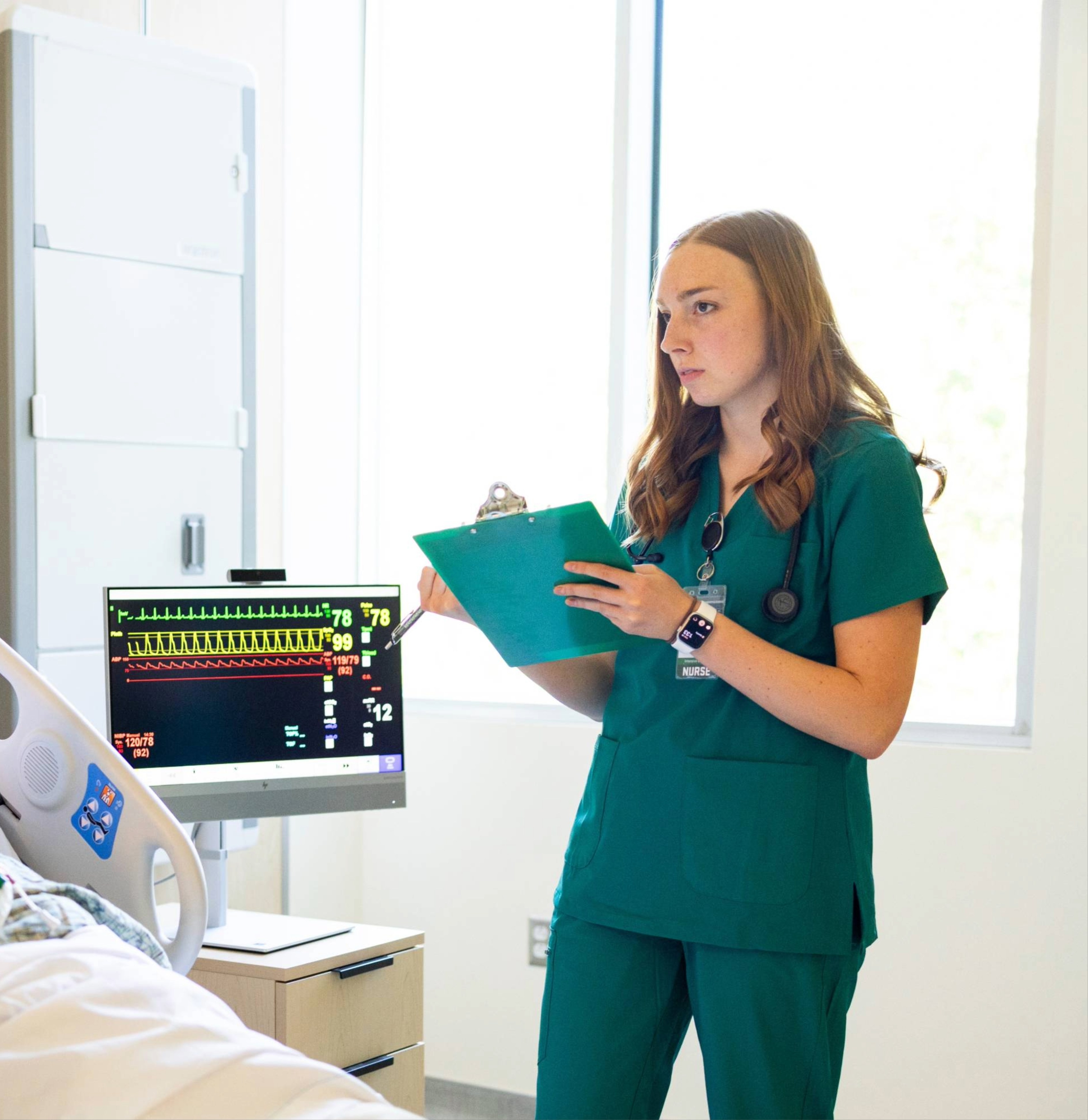 Respiratory Therapy, A.A.S. Respiratory Therapists speaking with a patient in the hallway.