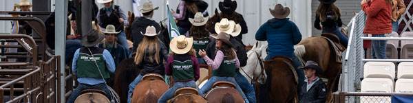 UVU Rodeo Team Entering an arena for a college rodeo event