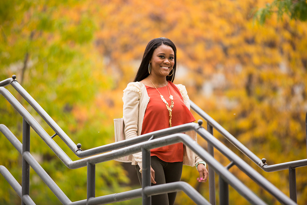 Student Walking A student walking outside campus in the fall.