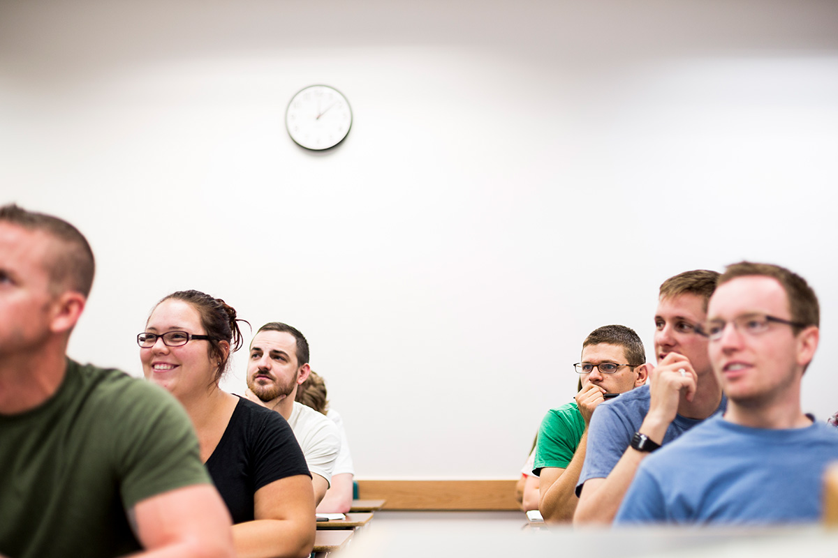 A group of students sitting in a classroom