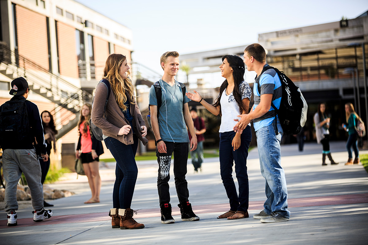 Group of students talking outside.