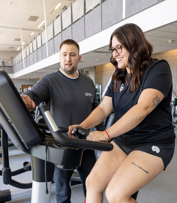 UVU personal trainer working with student