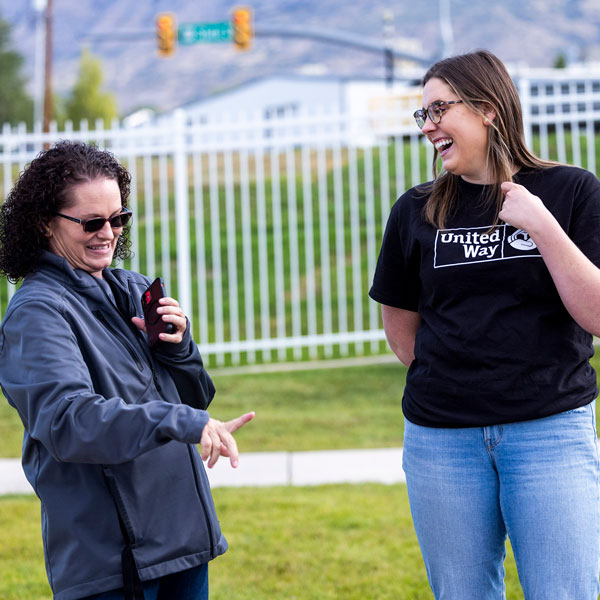 Community Social Impact Partner talking to UVU student