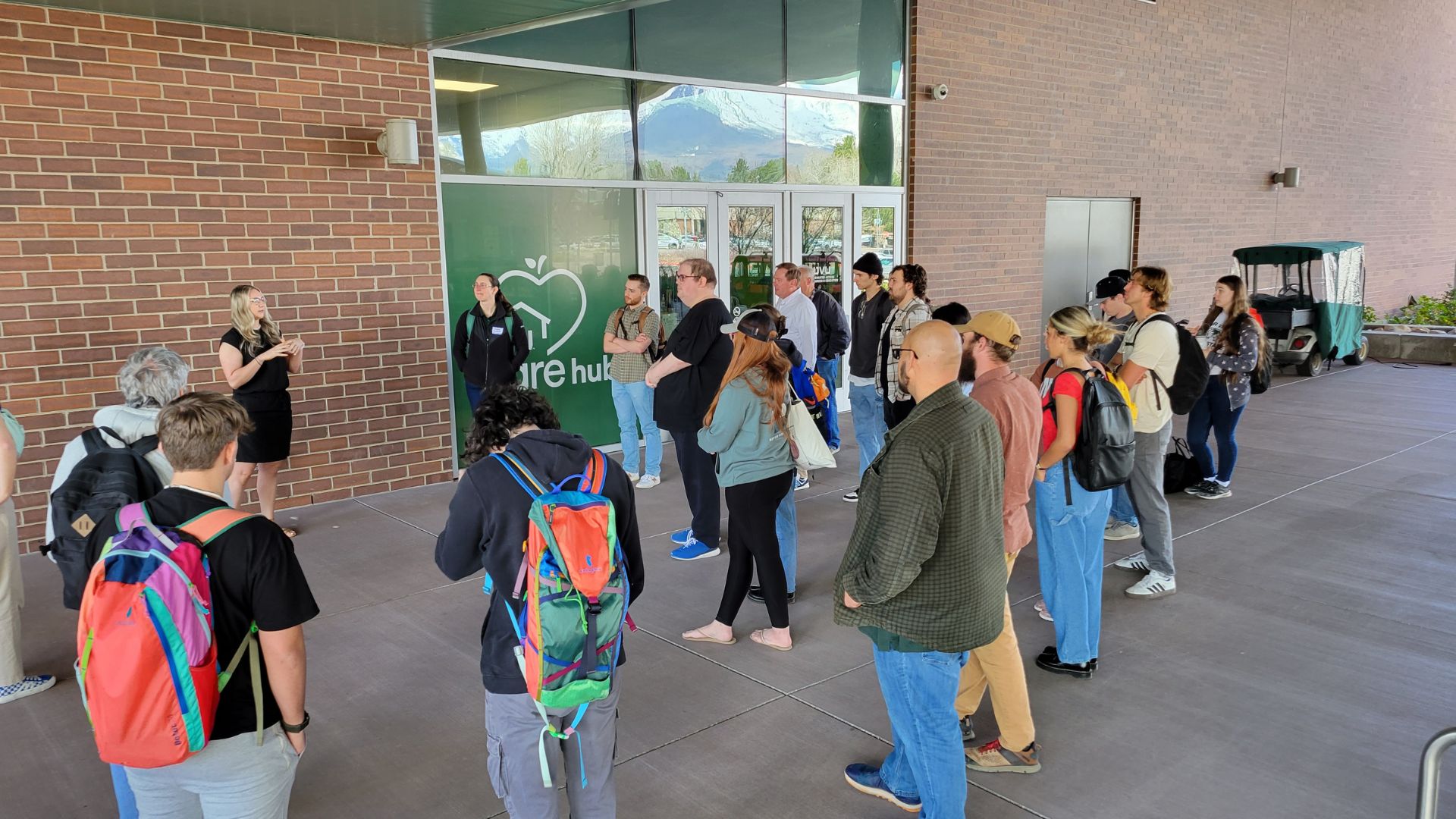 A group of people outside the UVU CARE Hub