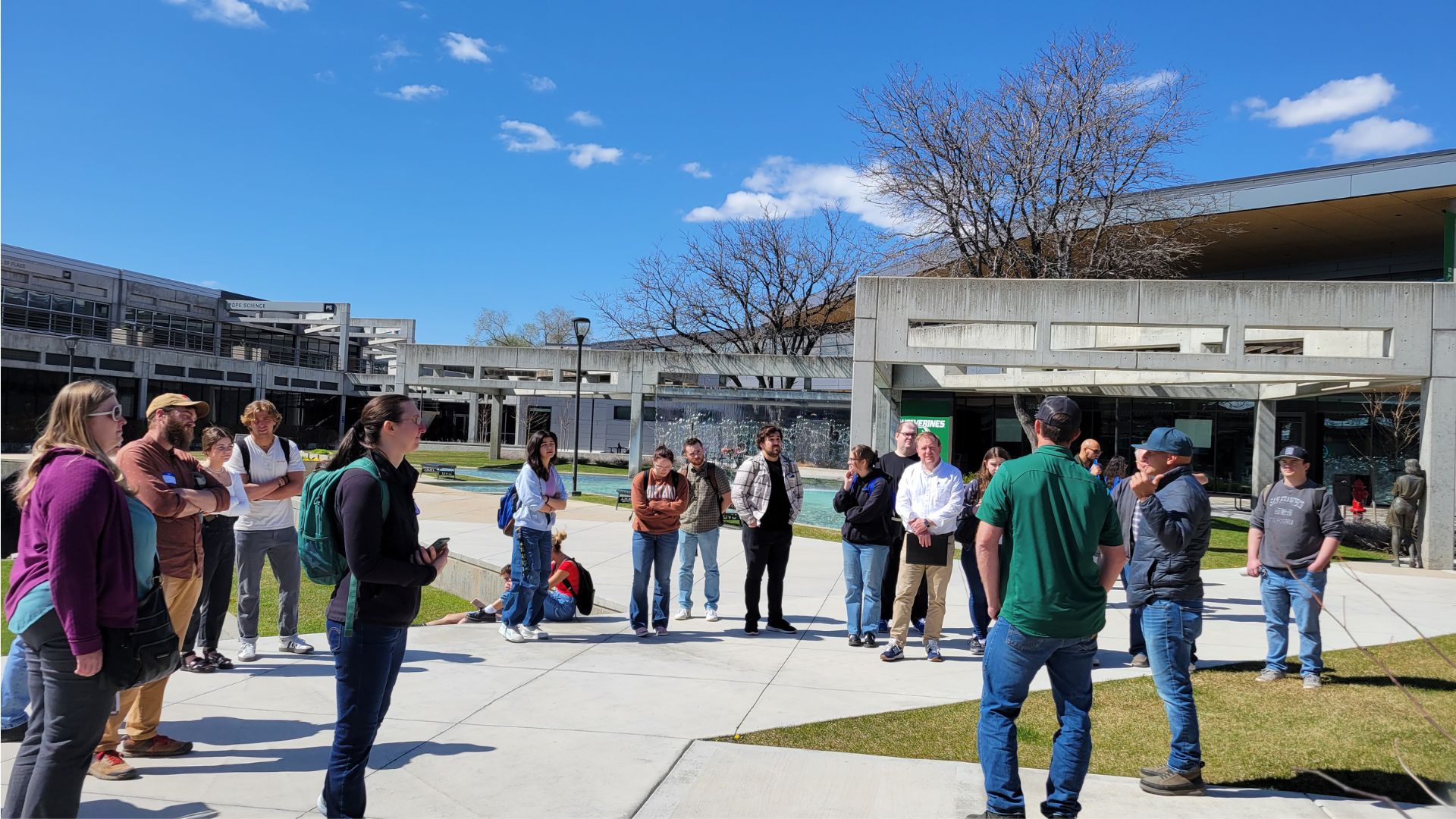 A group of people at the UVU Fountain Plaza