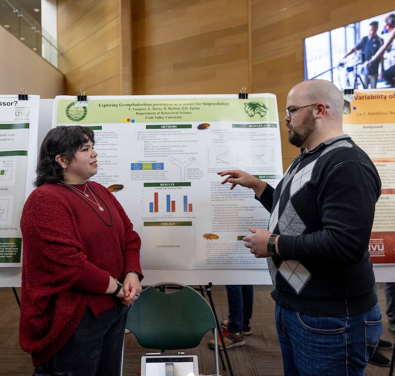 Image of a student explaining their poster 