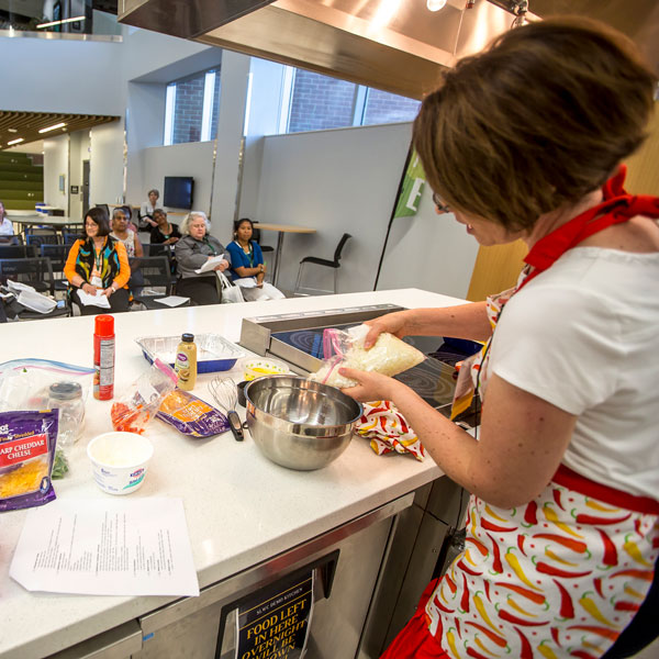 Wellness Programs Staff running a monthly cooking class at UVU